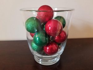 Use a glass vase and Christmas Ornaments to make cute dollar tree Christmas decorations.