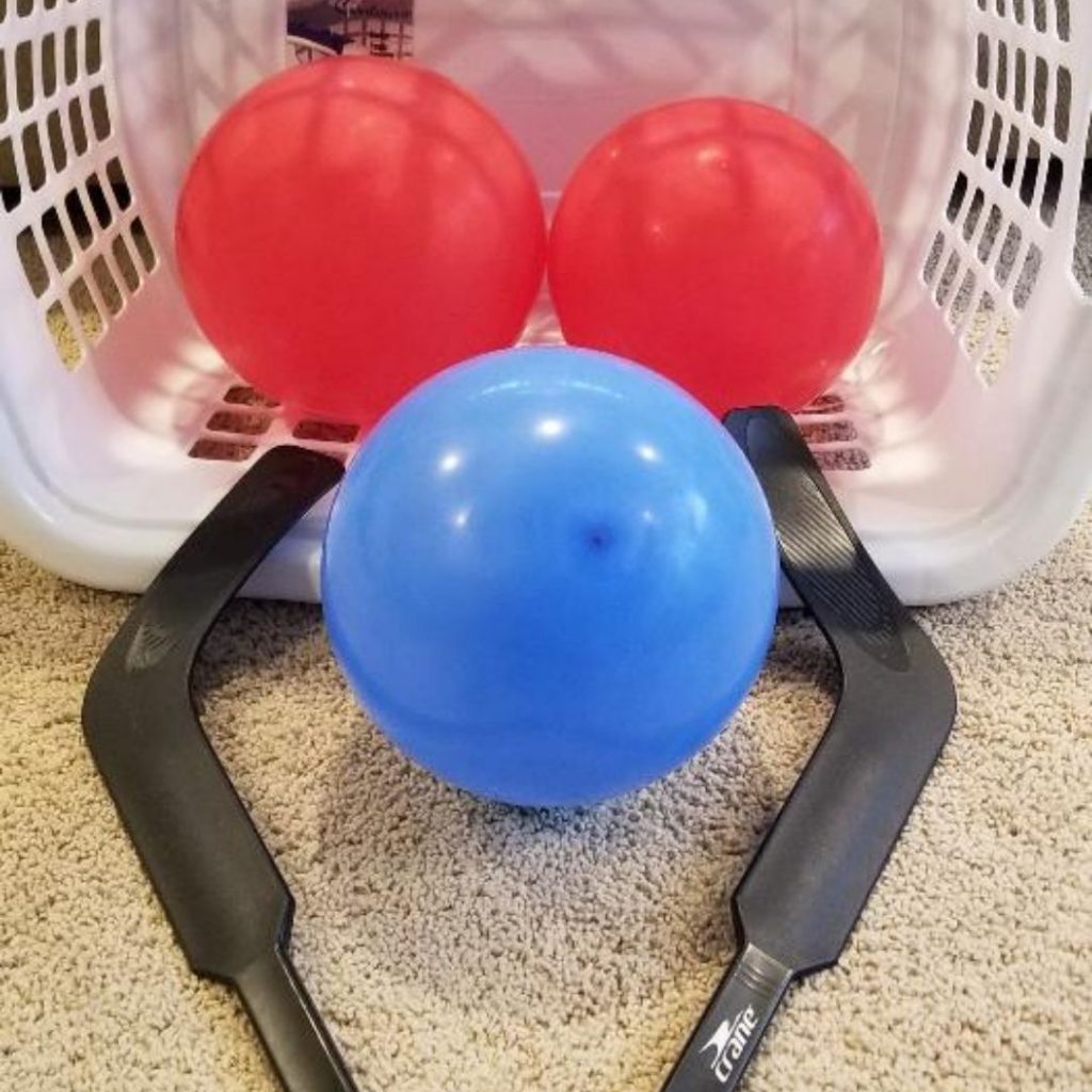 Laundry Basket Balloon Hockey a fun indoor game for kids.