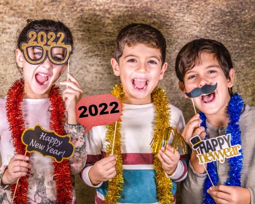 Plan a DIY Photo Booth for your at home New Year's Eve party. Kids and adults will have a blast with the silly props and taking different funny pictures together to ring in the New Year celebrations.