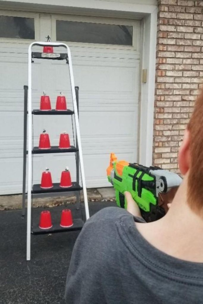 Easy DIY Nerf Target Practice with a ladder, solo cups and army men. Set it up for Nerf Wars Birthday parties or to entertain kids at home.