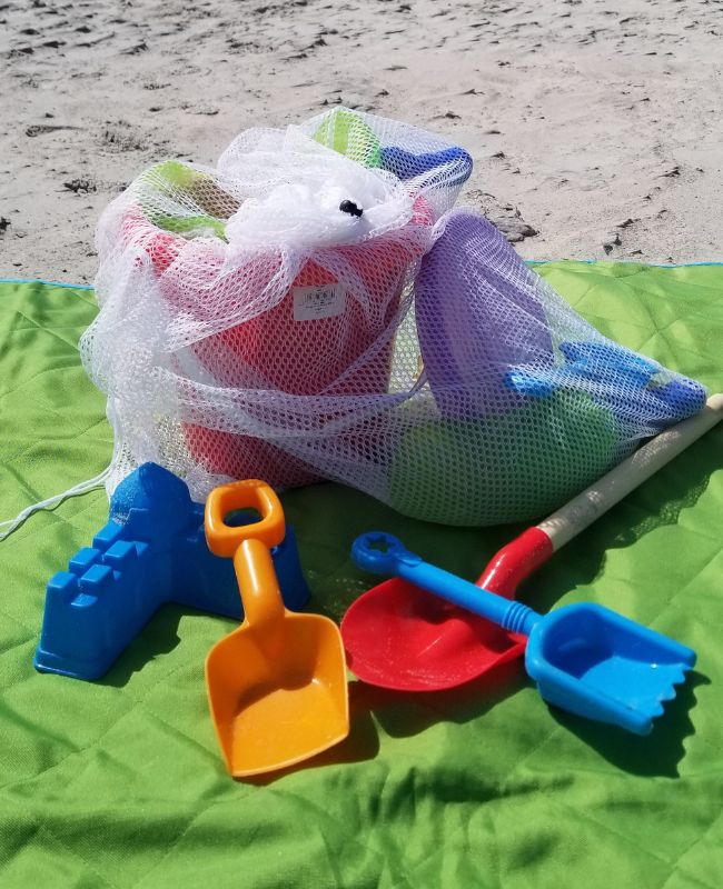 Shake the sand off your beach toys by packing them up in mesh laundry bag. A simple beach hack that works.