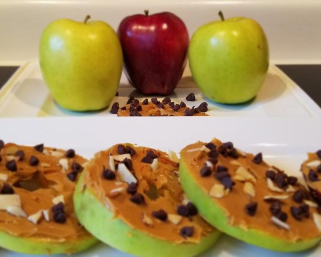 A fun fall snack is no bake Apple Slice Cookies. After you go fall apple picking make this easy snack with sliced apples, peanut butter and chocolate chips for kids and adults.