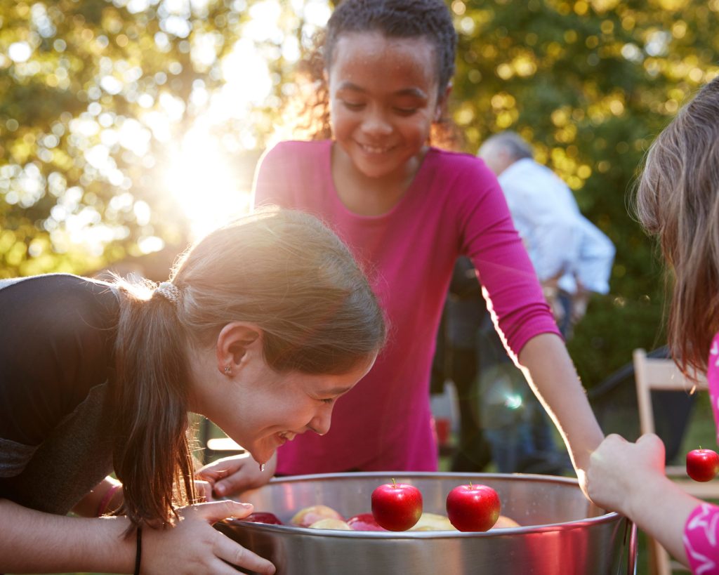 A fun thing to do in the fall is bobbing for apples. Kids will love the challenge of getting their apples out of the water with their teeth.
