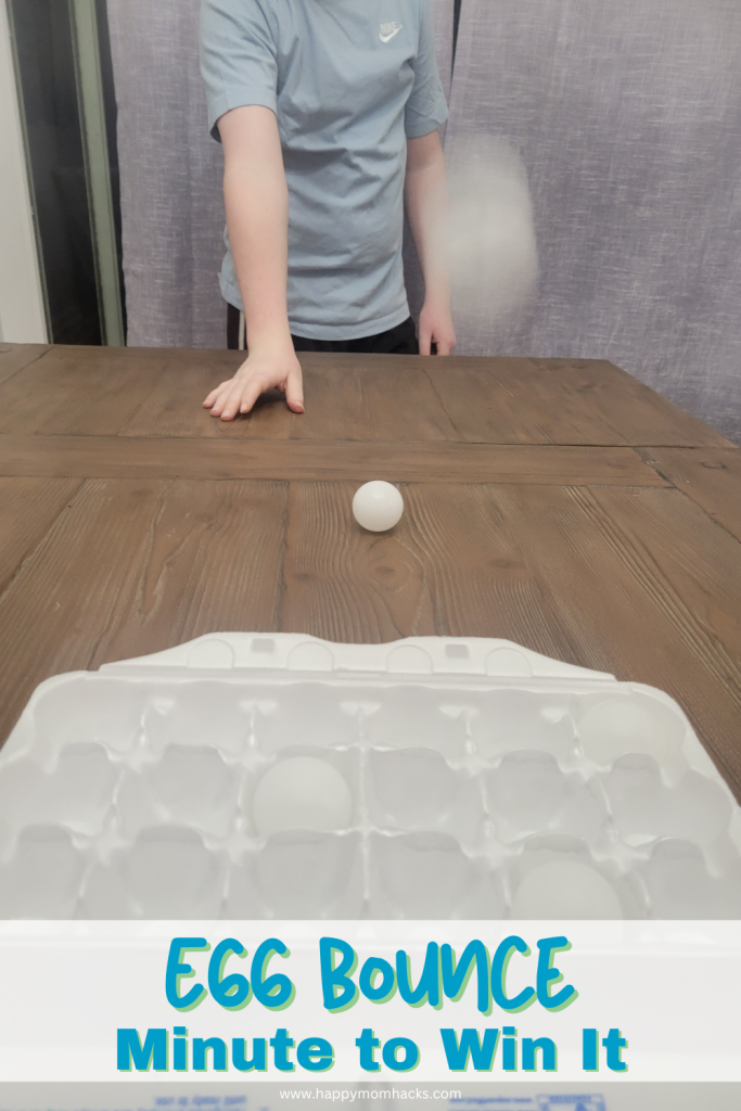 A minute to win it game bouncing a ping-pong ball off a table and into a egg carton. 