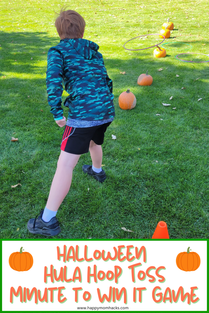 Fun Halloween Minute to Win It Game tossing a hula hoop over a row of Pumpkins. A quick 60 second challenge for classroom parties, Halloween parties or Halloween game nights that kids, teens and adults will have a blast playing!