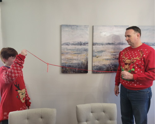 Slide the candy cane down a string in this fun Christmas Minute to Win it Game.