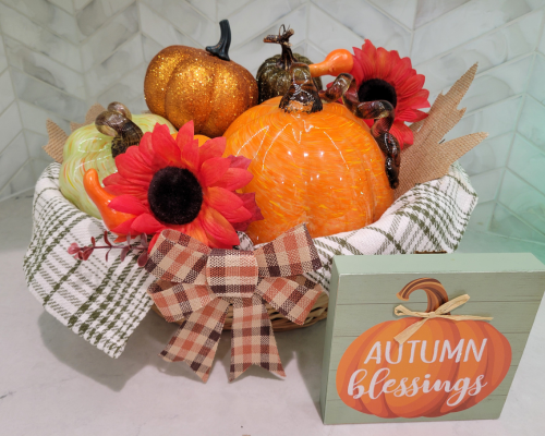 Create a DIY Fall Basket filled with pumpkins as fun and easy Fall decorations with Dollar Tree items.