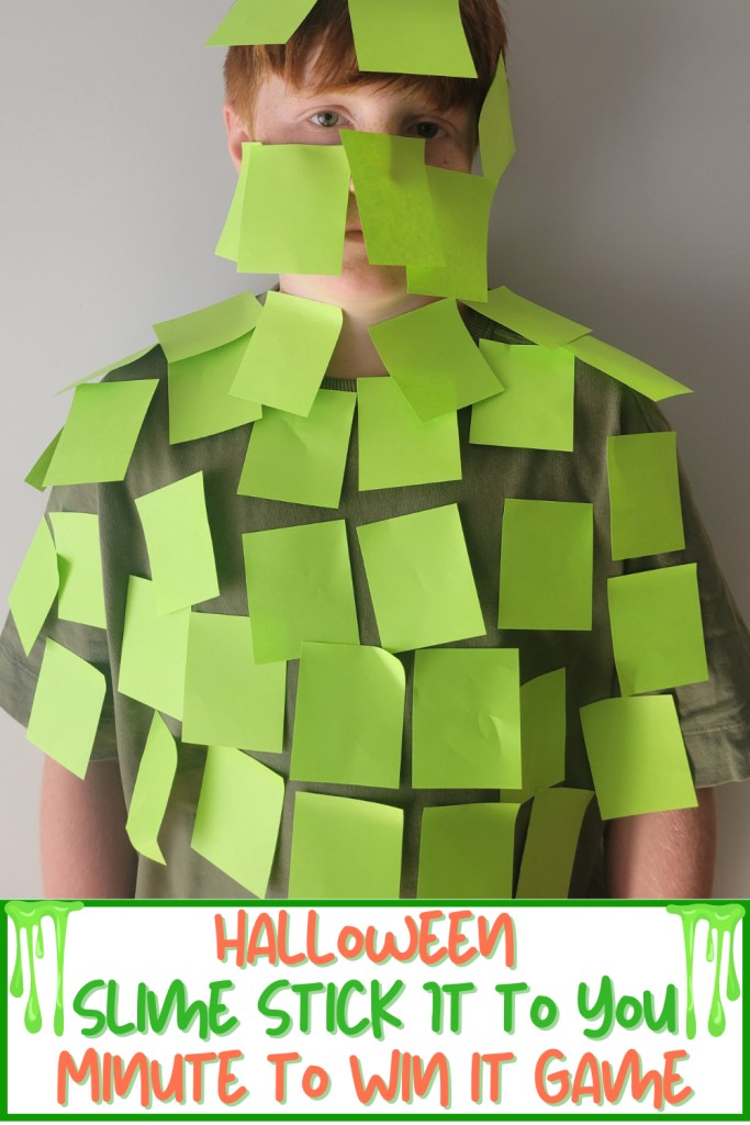 Hilarious Slime Stick it to You Halloween Minute to Win It Game. A fun 60 second challenge to stick green sticky notes to a teammate & cover their body before the time is up. A funny Halloween party game for classrooms, Halloween parties at home, adult halloween parties, halloween office parties, youth group parties and teen parties that all ages will enjoy!