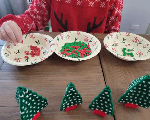 See how quickly you can divide a bowl of red and green M&Ms in a Christmas Minute to Win It Game.