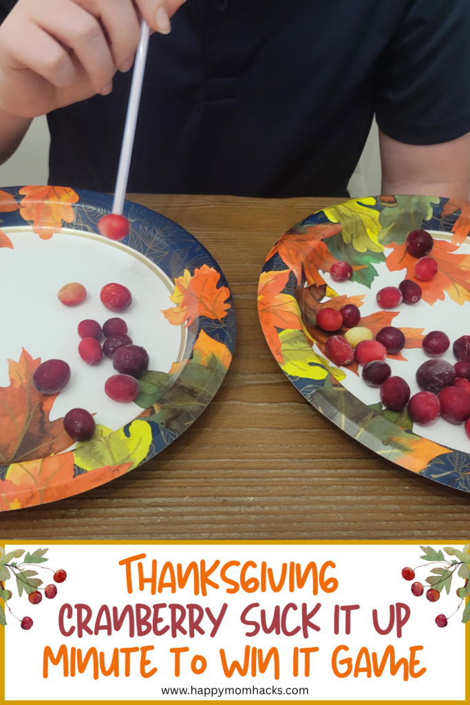 Cranberry Minute to Win It Thanksgiving game challenging friends and family to suck up the cranberries with a straw and moving them to another plate. A fun Thanksgiving party game to play on Thanksgiving Day, as Friendsgiving games, classroom games, or family game nights.