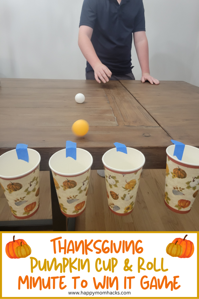 Fun Thanksgiving Cup & Roll Minute to Win it game for kids, teens and adults. Tape cups the edge of table and try to roll ping pong balls into the cups in 60 seconds. A fun Thanksgiving game that's easy to set up and funny to watch.