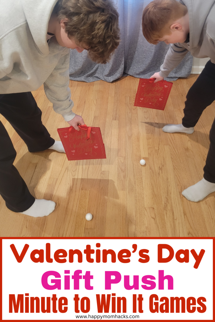 Fun Valentine's Day Minutet to Win it Game Gift Push. Kids, teens and adults will love competing to use gift boxes to push a ping pong ball to the finish line. Perfect party game for Valentine's Day Parties, classroom parties, Galentine's day or family game nights.