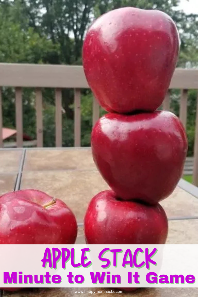 Fun Family Reunion Minute to Win it Game trying to stack apples and keep them stack for one minute. An easy indoor or outdoor family reunion game that will challenge kids, teens and adutls with the whole family playing this fun party game.