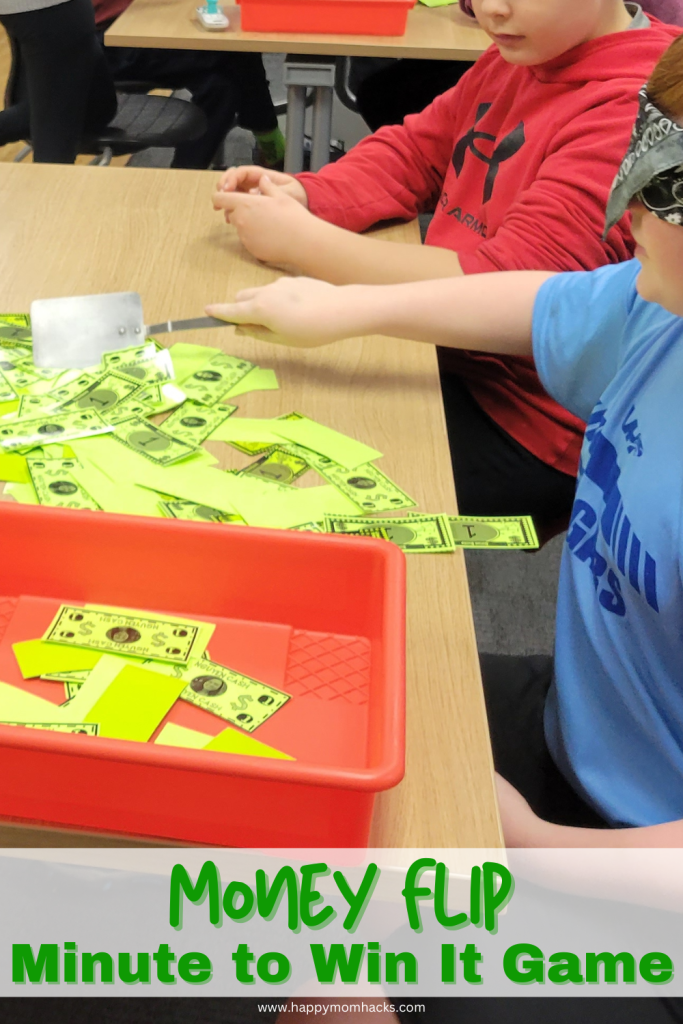Fun Classroom Minute to Win It Game Money flip. A quick 60 second challenge with students blindfolded and using a spatula to flip money into a box. Get help from your teamates to guide you to the money. Great classroom party game for back to school, holiday parties or end of school year parties.